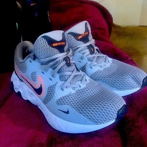 Nike renew. Size 12. Light gray, black, neon orange swoosh.
